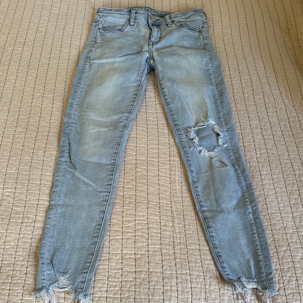 Distressed Light wash American eagle jeans